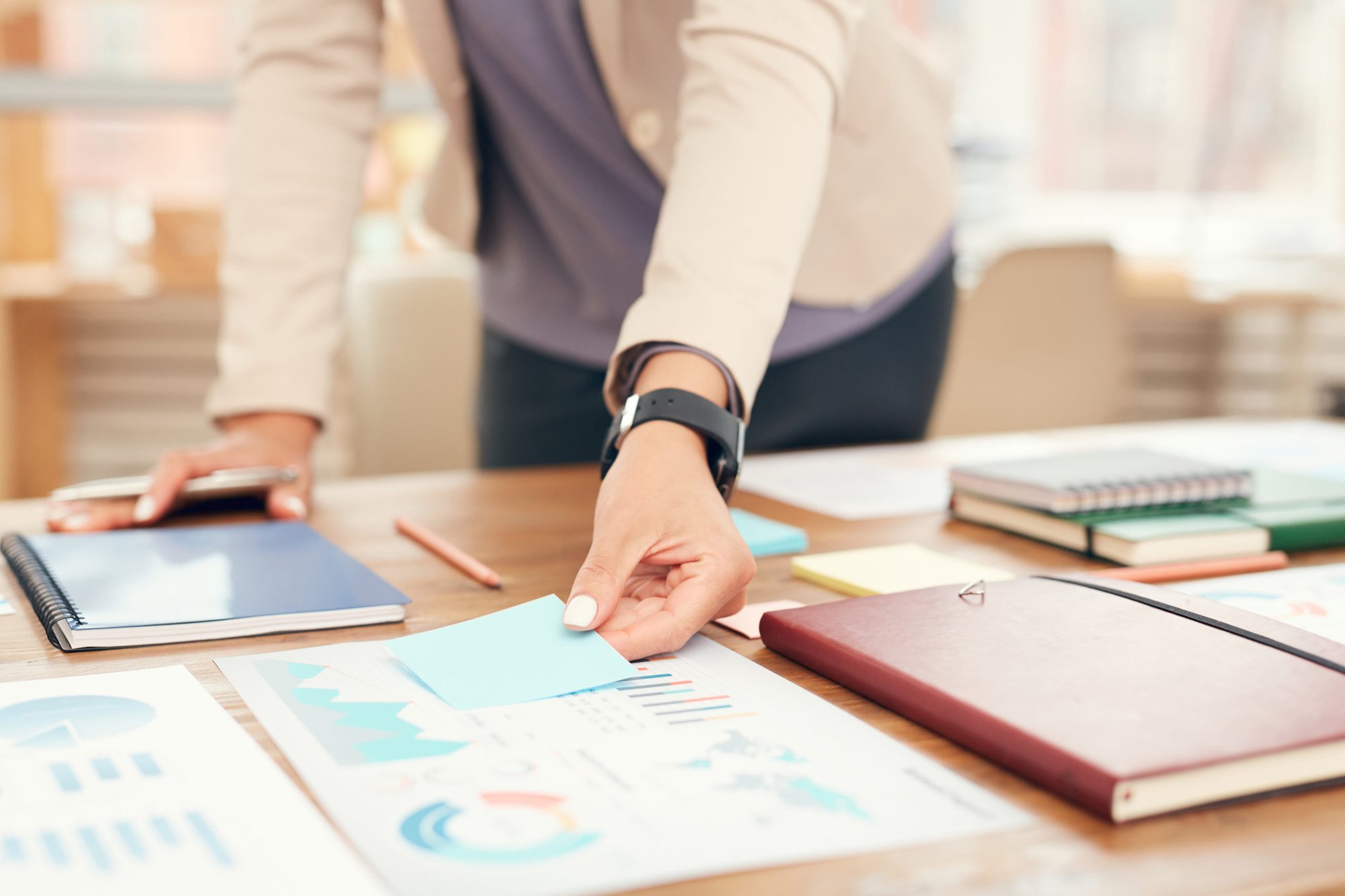 businessman-standing-at-workplace-close-up-GY8BBJC-scaled